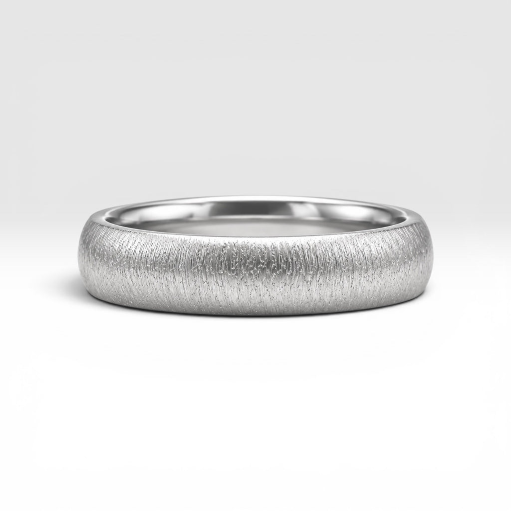 4mm domed women's wedding band with fine vertical texture creating a luminous sparkle effect