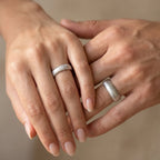 Domed wedding bands set with fine vertical texture creating a luminous sparkle effect