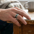 Verdantis titanium ring featuring genuine nephrite jade, brass shavings, and a frosted handcrafted finish by Venus Rings.