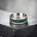 Verdantis titanium ring featuring genuine nephrite jade, brass shavings, and a frosted handcrafted finish by Venus Rings.