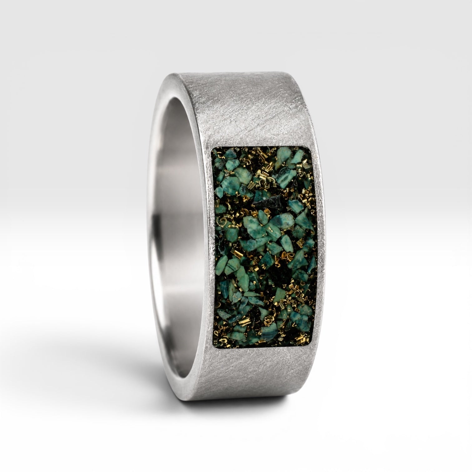 Veridian titanium ring featuring genuine nephrite jade and brass shavings in a modern rectangular inlay with a satin finish.