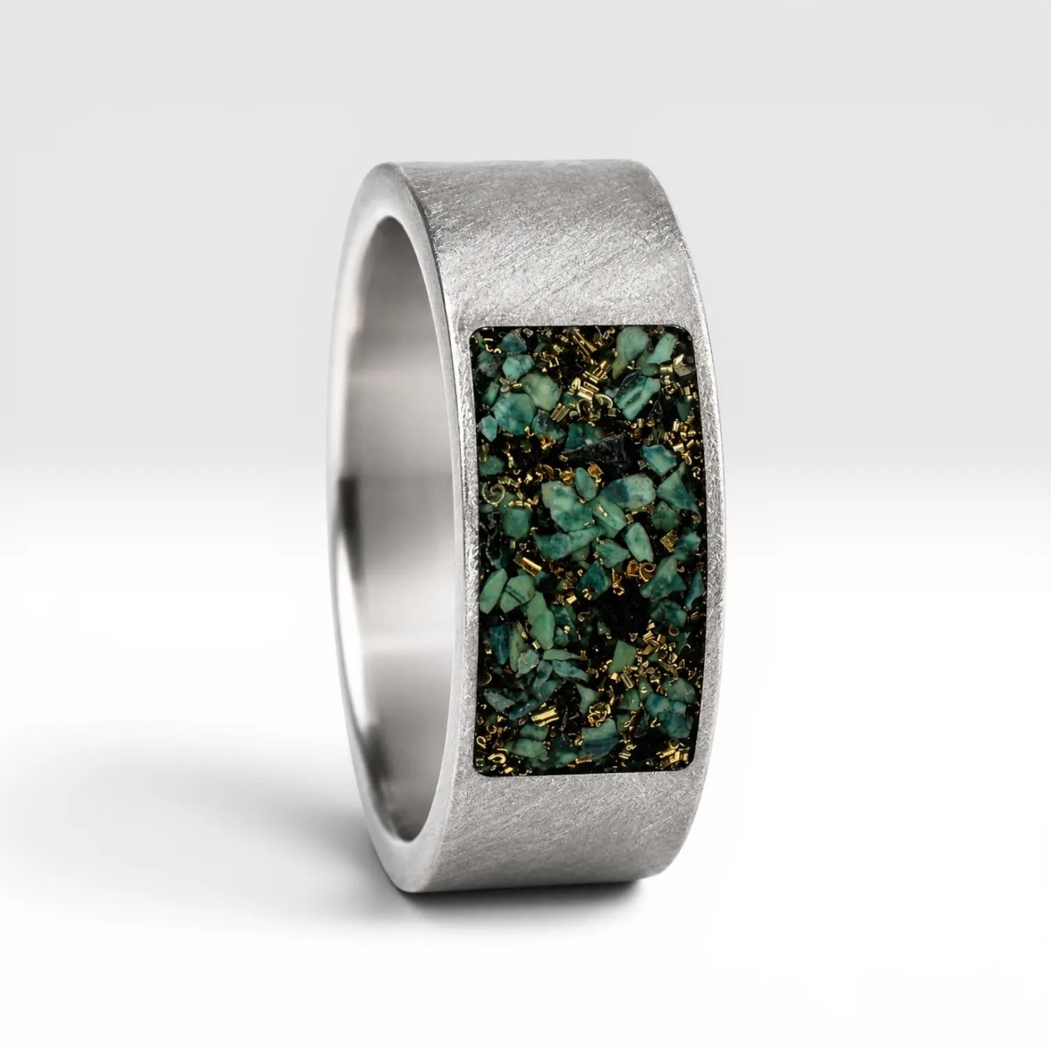 Veridian titanium ring featuring genuine nephrite jade and brass shavings in a modern rectangular inlay with a satin finish.