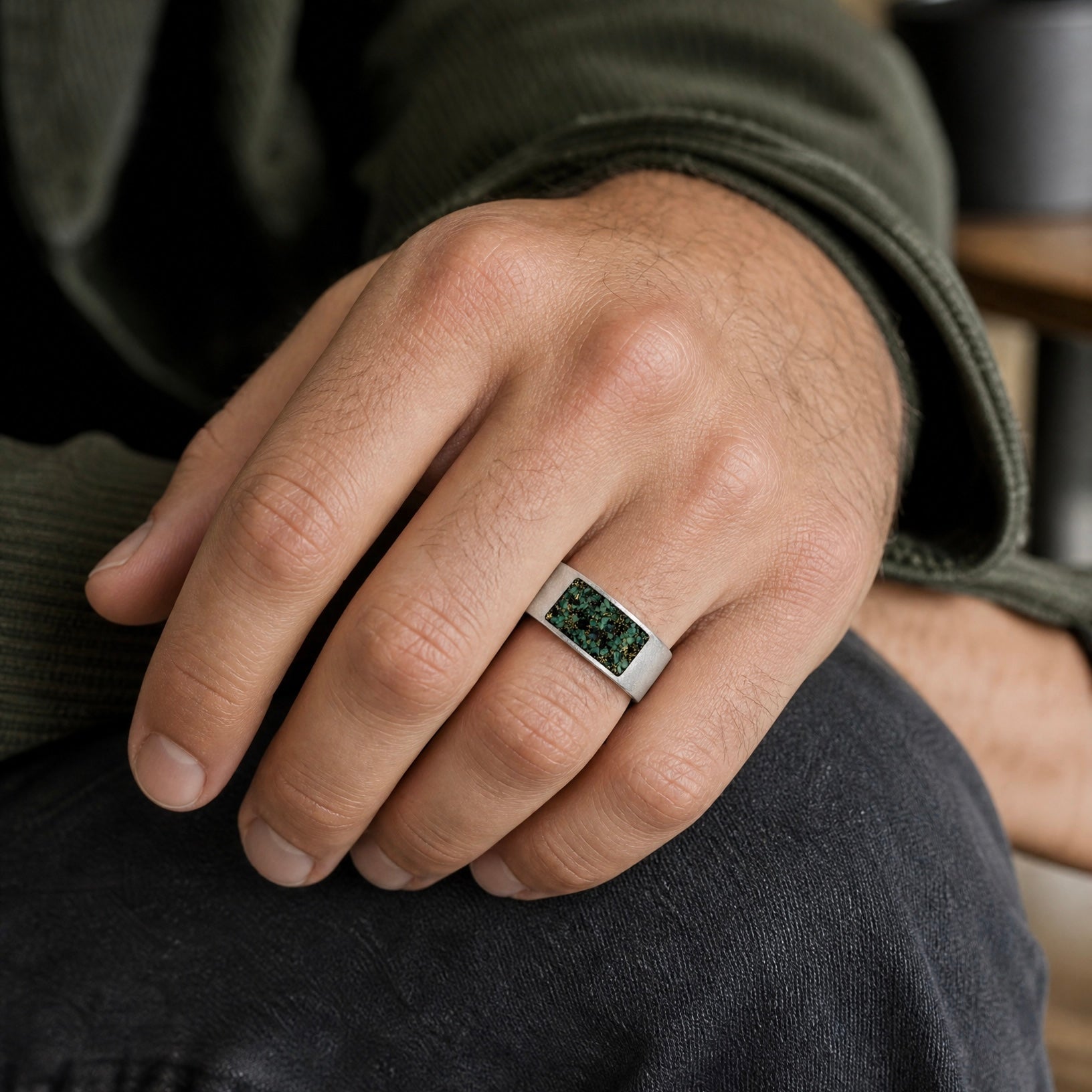 Veridian titanium ring featuring genuine nephrite jade and brass shavings in a modern rectangular inlay with a satin finish.