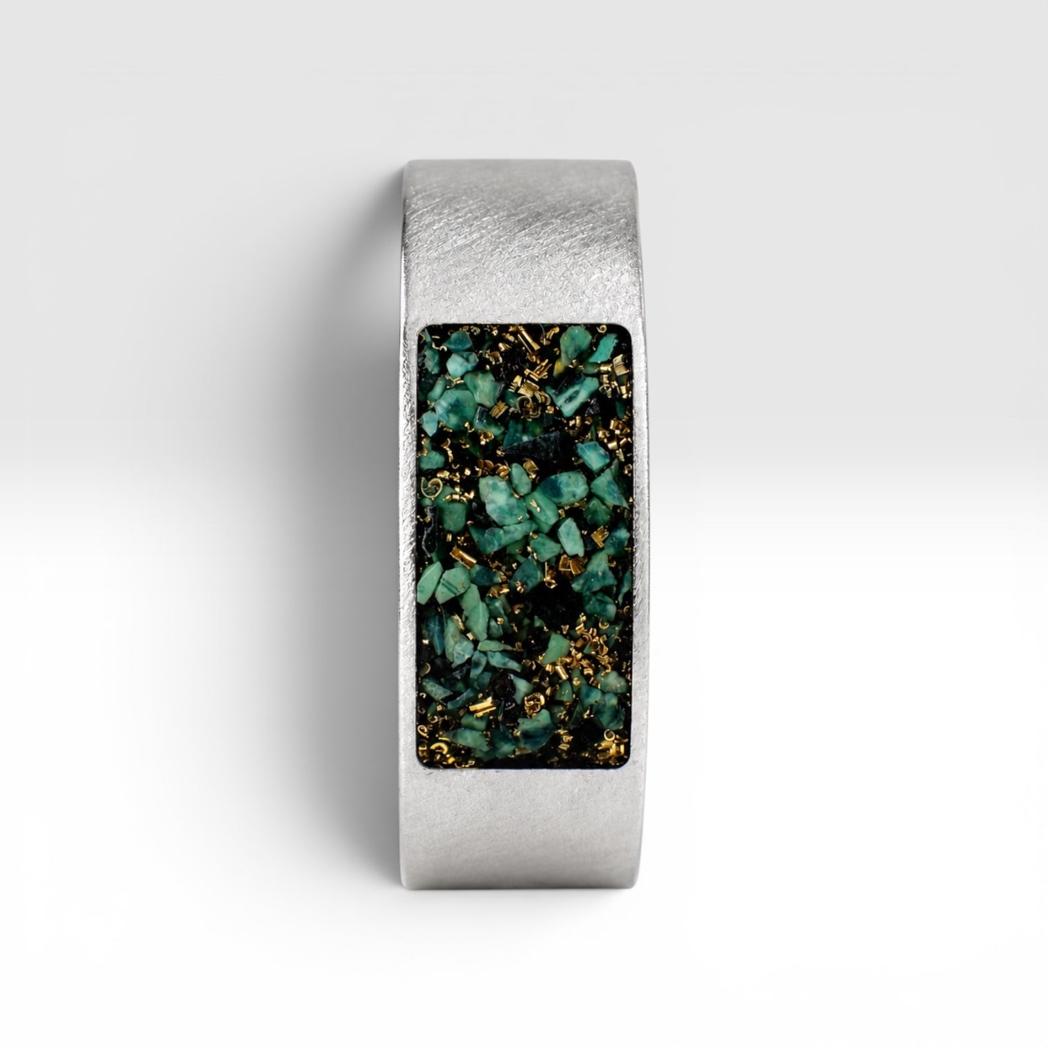 Veridian titanium ring featuring genuine nephrite jade and brass shavings in a modern rectangular inlay with a satin finish.