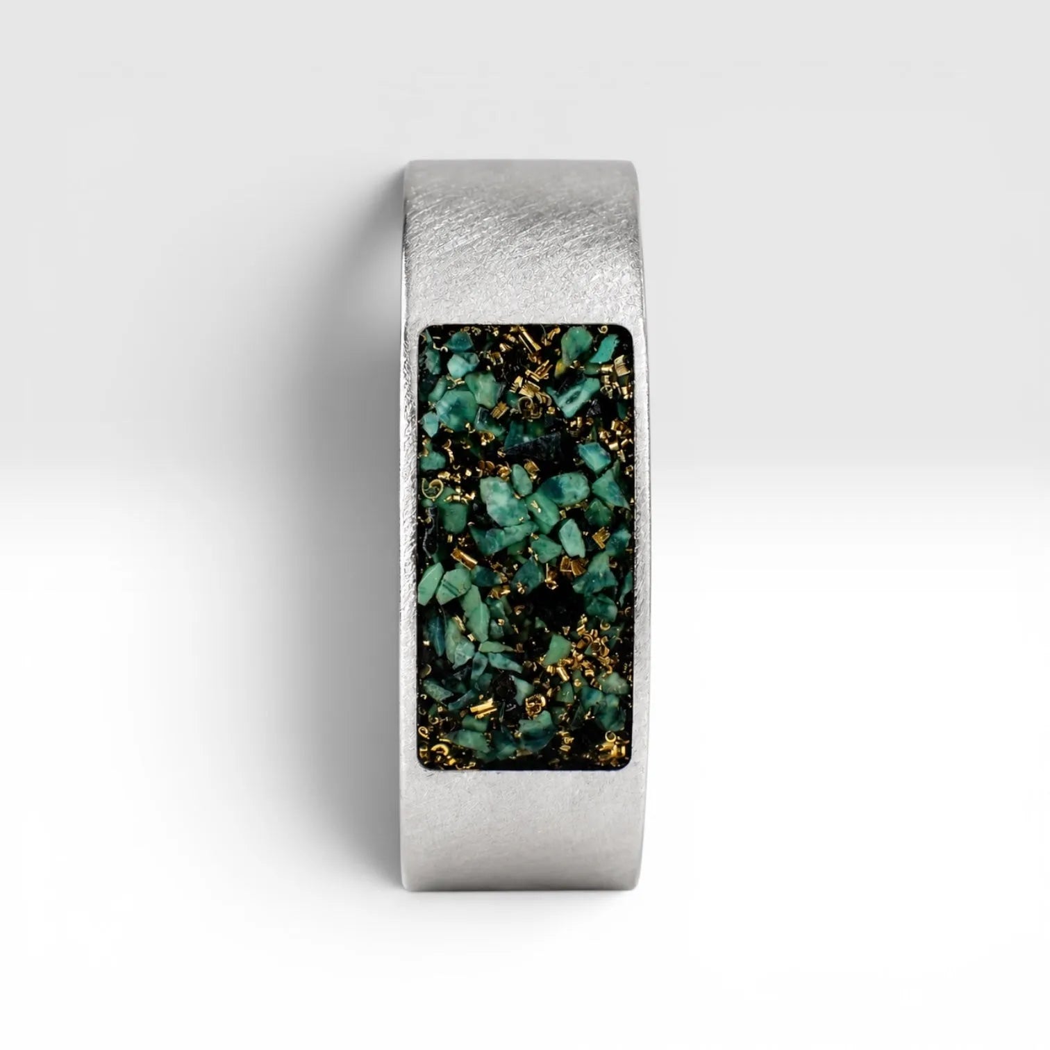 Veridian titanium ring featuring genuine nephrite jade and brass shavings in a modern rectangular inlay with a satin finish.