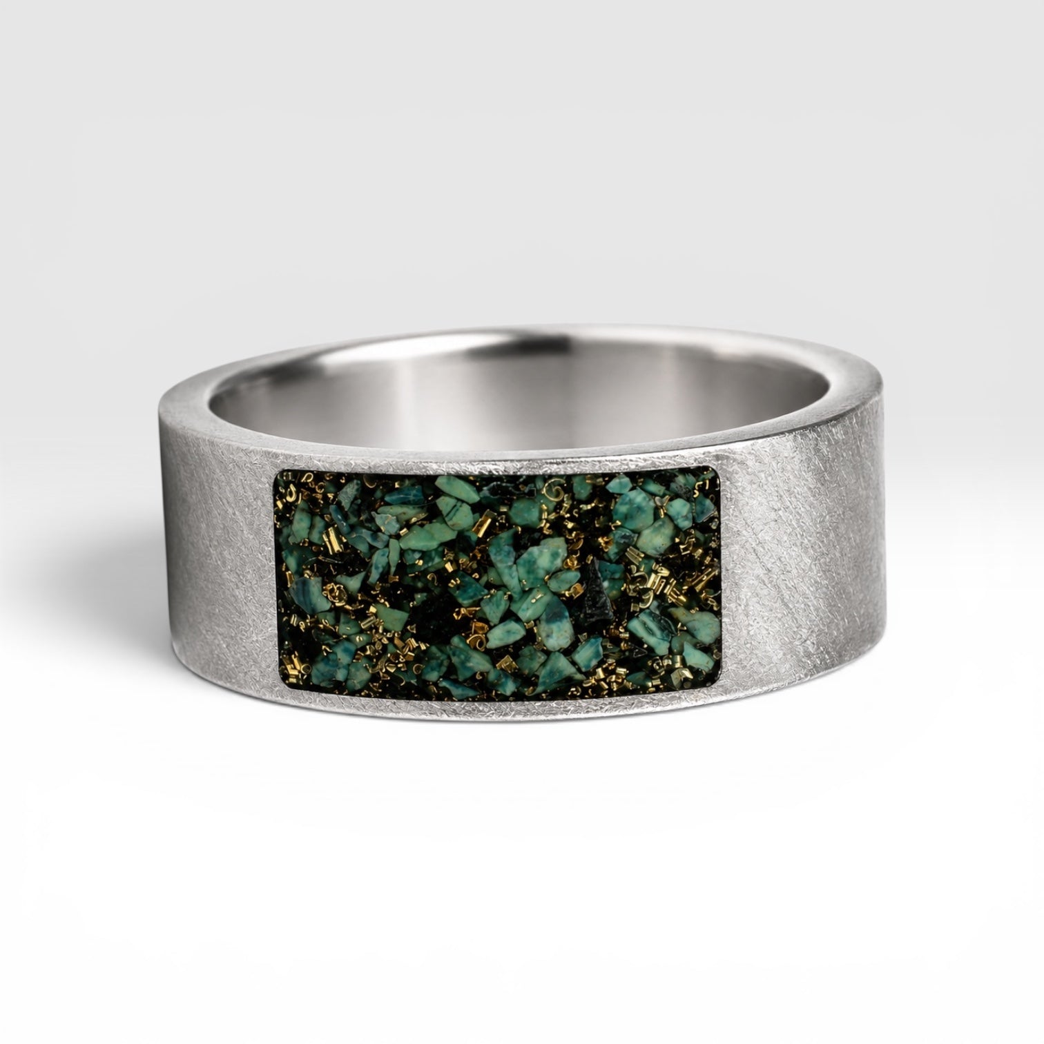 Veridian titanium ring featuring genuine nephrite jade and brass shavings in a modern rectangular inlay with a satin finish.