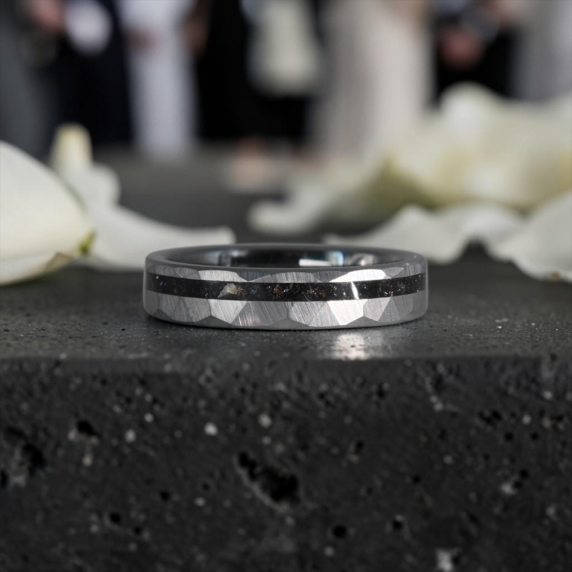 Slim tungsten wedding ring with black tourmaline and gold inlay, faceted finish with refined elegant design