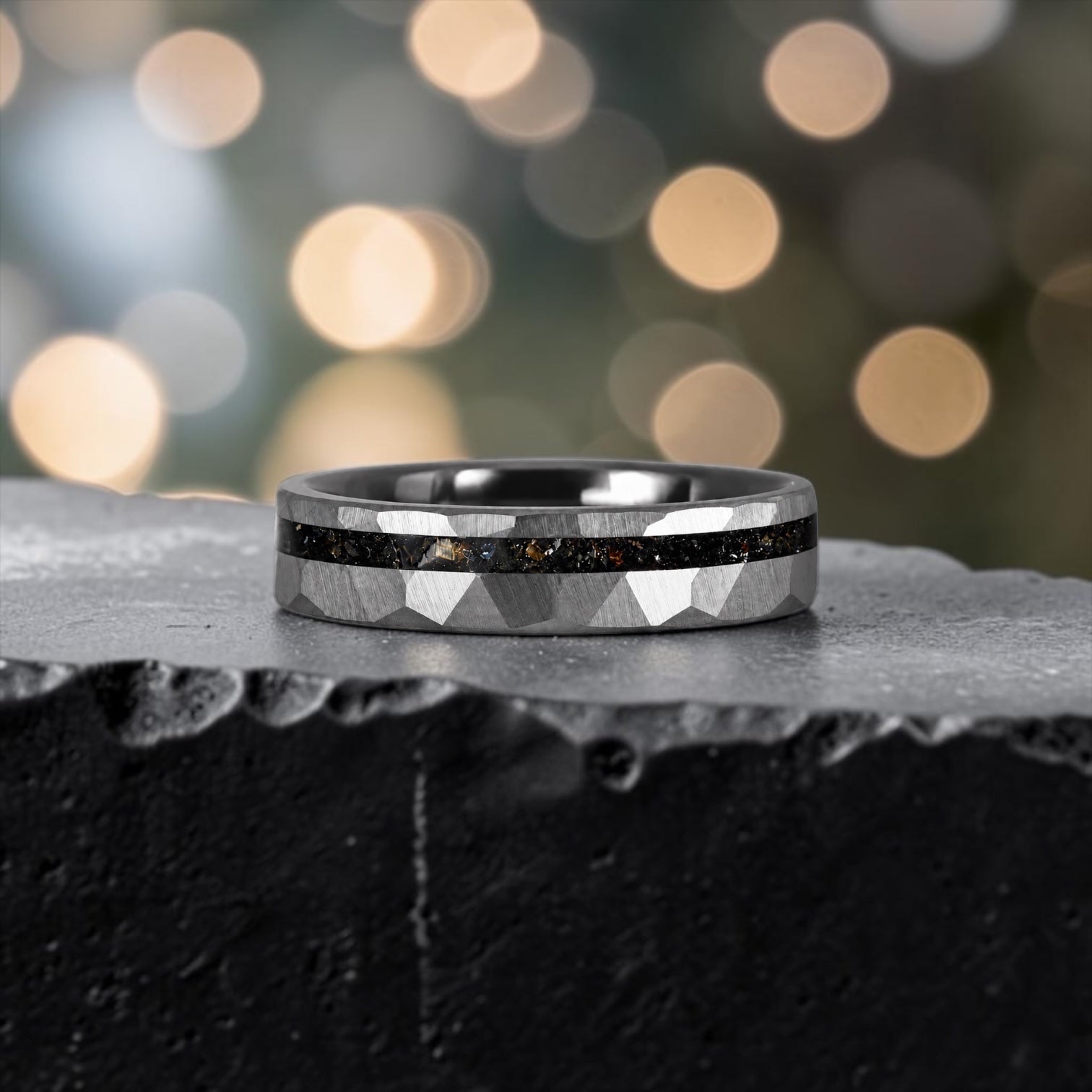 Slim tungsten wedding ring with black tourmaline and gold inlay, faceted finish with refined elegant design