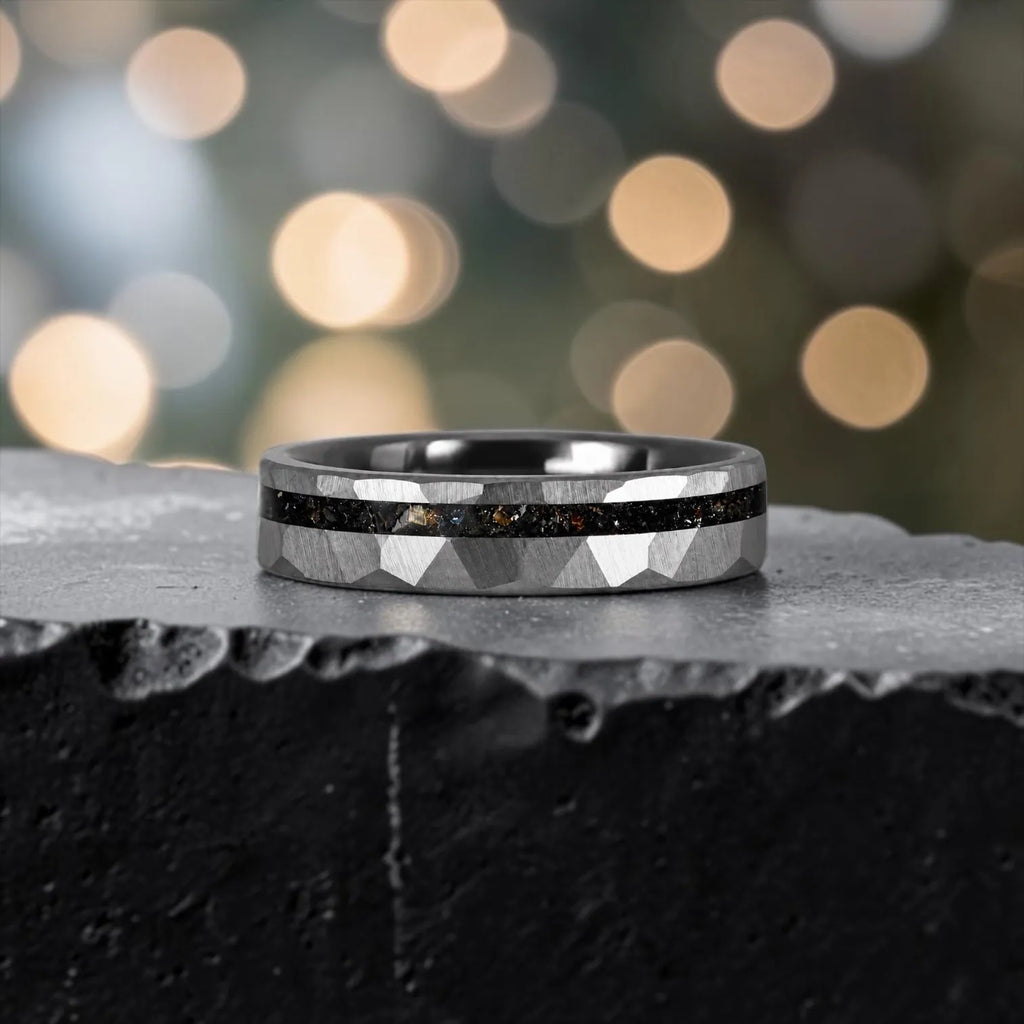 Slim tungsten wedding ring with black tourmaline and gold inlay, faceted finish with refined elegant design