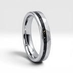 Slim tungsten wedding ring with black tourmaline and gold inlay, faceted finish with refined elegant design