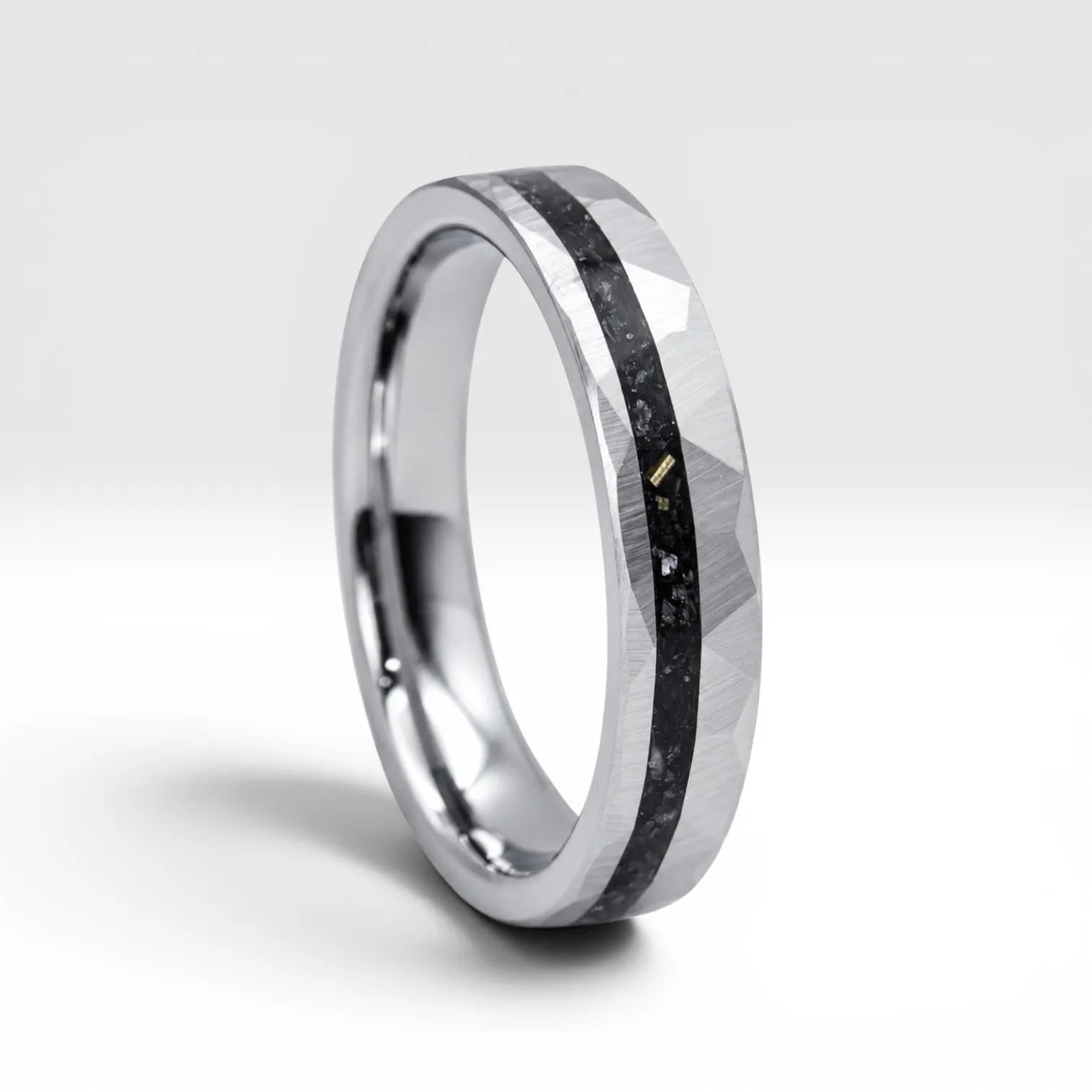 Slim tungsten wedding ring with black tourmaline and gold inlay, faceted finish with refined elegant design