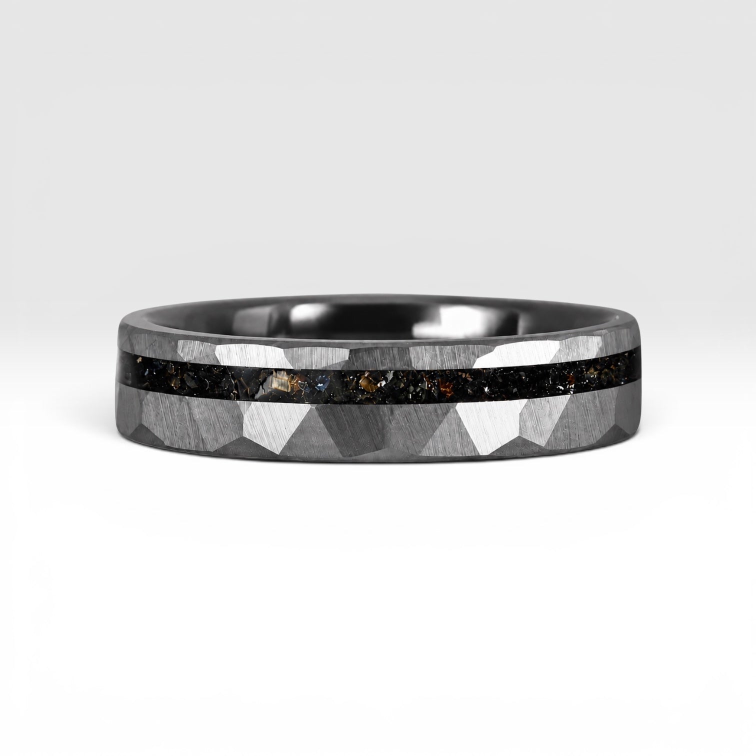Slim tungsten wedding ring with black tourmaline and gold inlay, faceted finish with refined elegant design