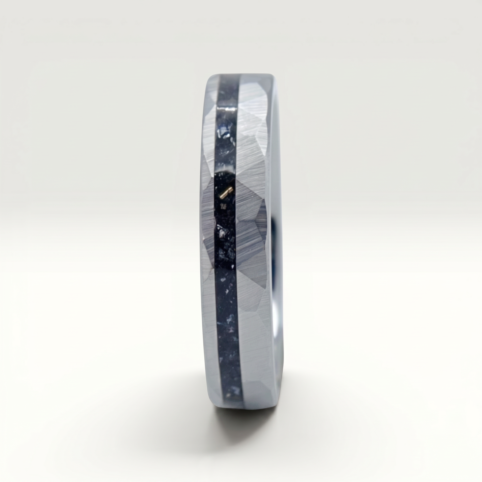 Slim tungsten wedding ring with black tourmaline and gold inlay, faceted finish with refined elegant design
