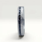 Slim tungsten wedding ring with black tourmaline and gold inlay, faceted finish with refined elegant design