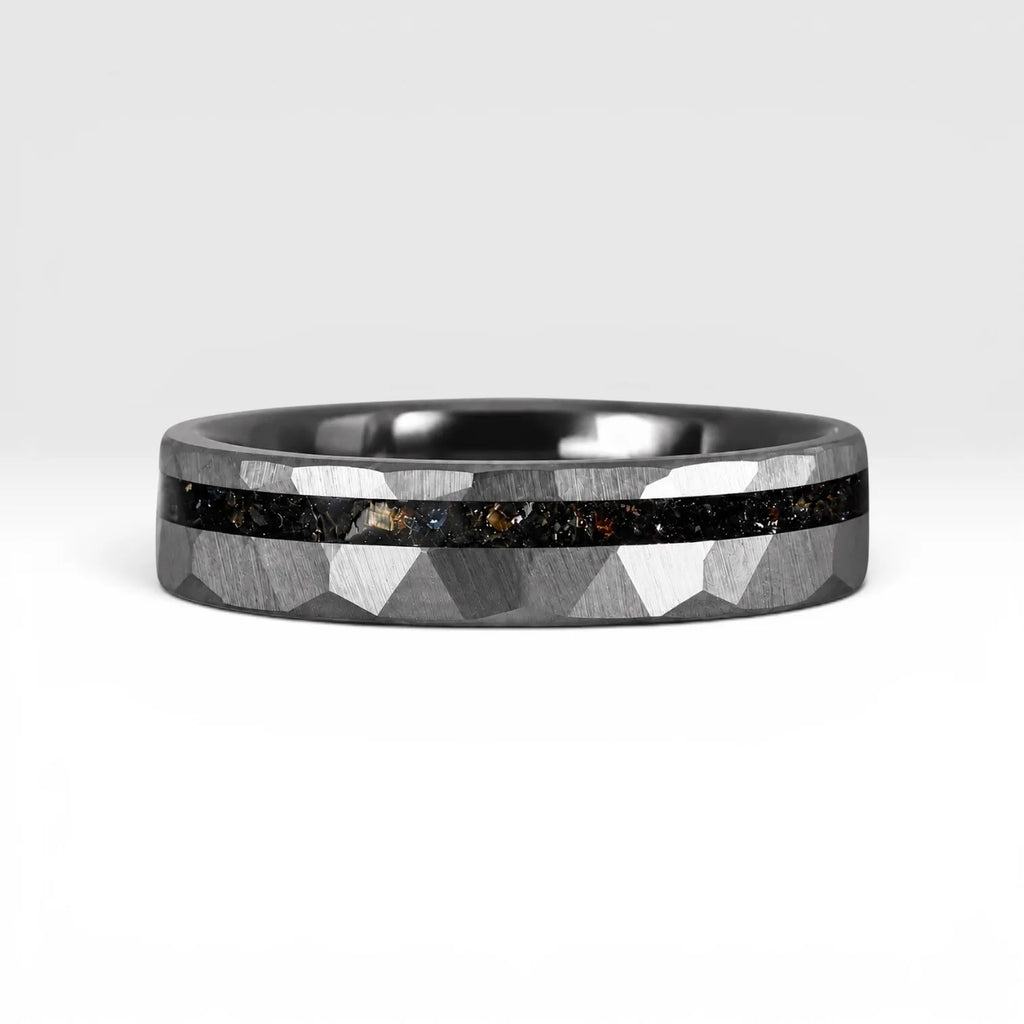 Slim tungsten wedding ring with black tourmaline and gold inlay, faceted finish with refined elegant design