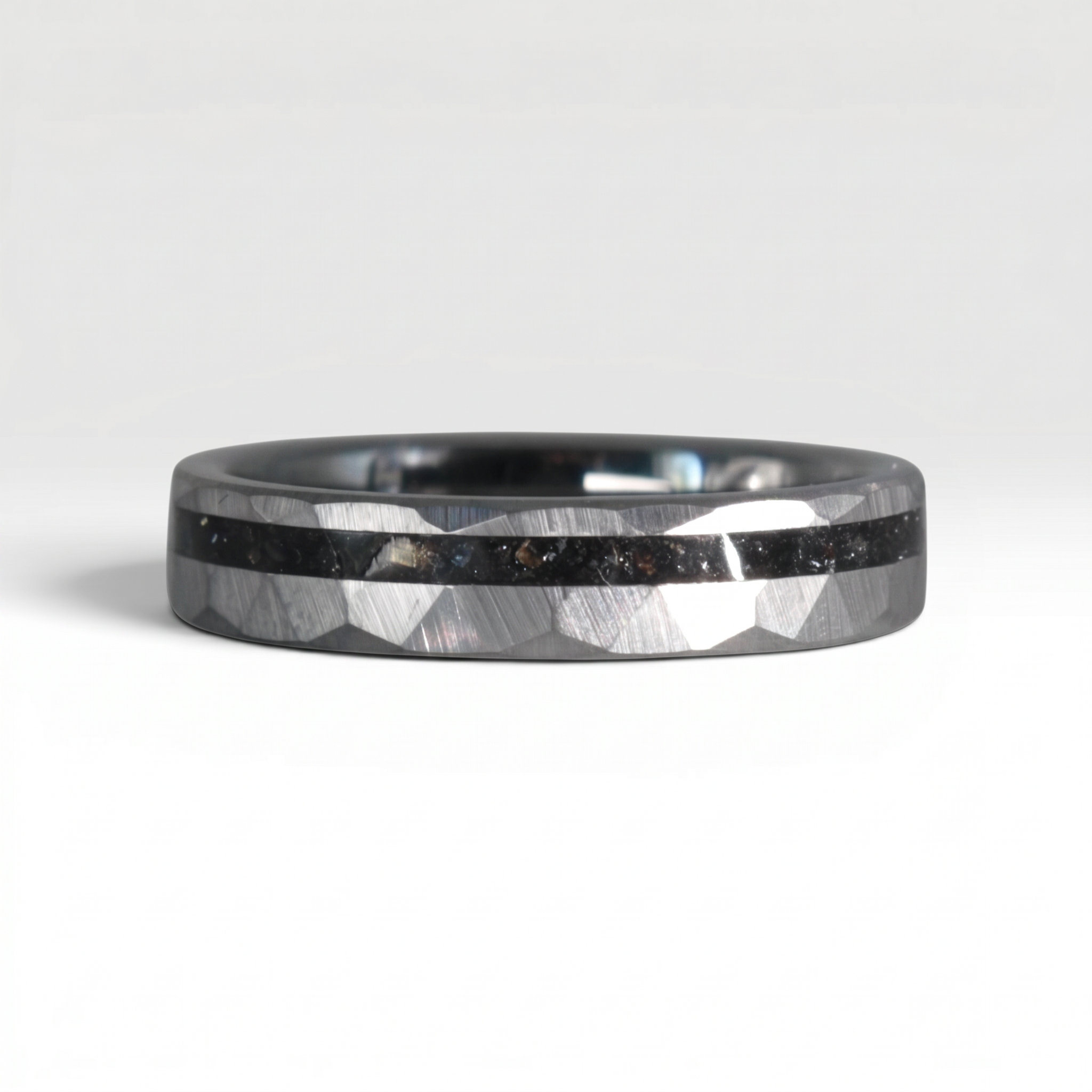 Slim tungsten wedding ring with black tourmaline and gold inlay, faceted finish with refined elegant design