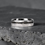 Faceted tungsten wedding ring with black tourmaline and 14k gold inlay in a 2mm offset channel
