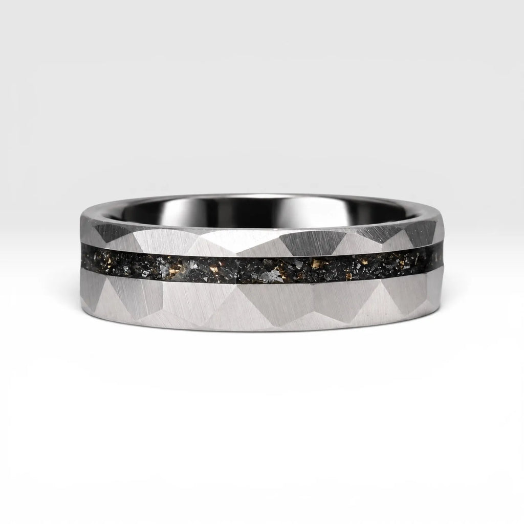 Faceted tungsten wedding ring with black tourmaline and 14k gold shavings inlay in a 2mm offset channel