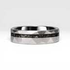 Faceted tungsten wedding ring with black tourmaline and 14k gold shavings inlay in a 2mm offset channel