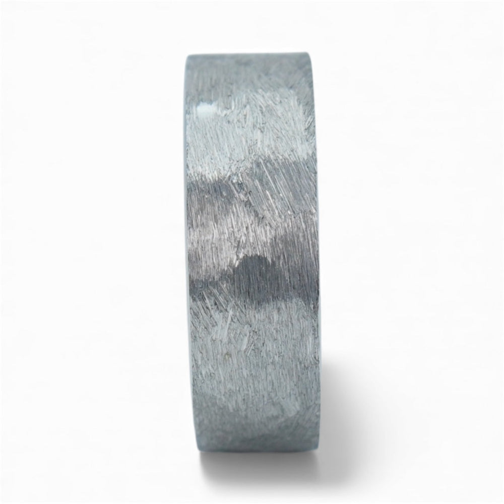 Rustic tungsten band with reclaimed whiskey barrel wood sleeve interior and forged surface finish