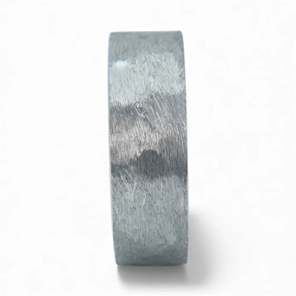 Rustic tungsten band with reclaimed whiskey barrel wood sleeve interior and forged surface finish